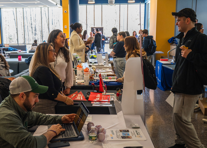 Job fair attendee speaking with employer